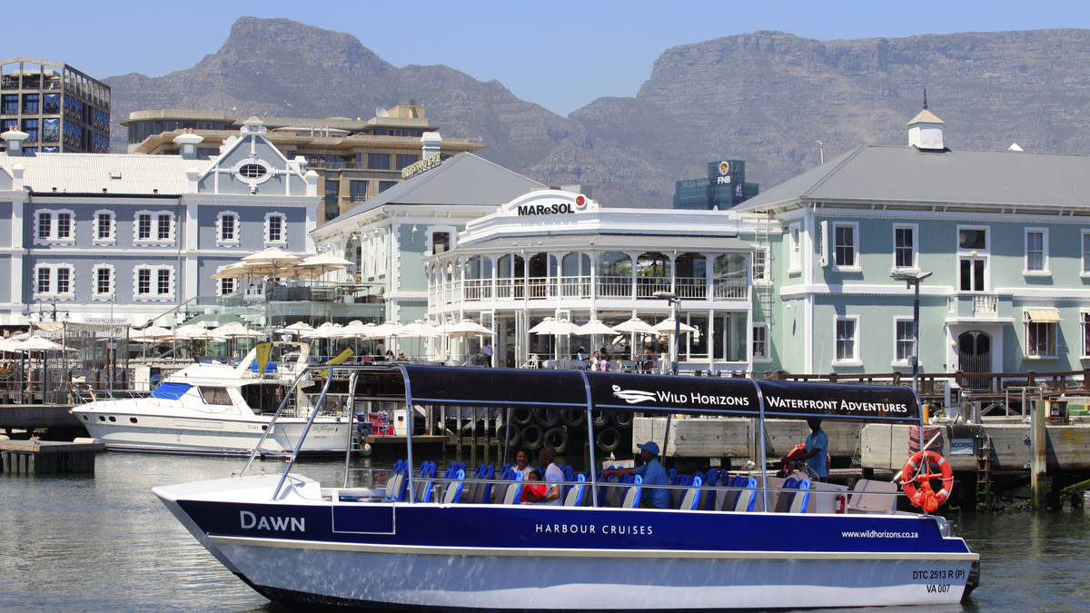 Harbour cruise boat at the V&A Waterfront with Table Mountain behind